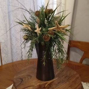 Coastal pitcher with shells starfish and greens